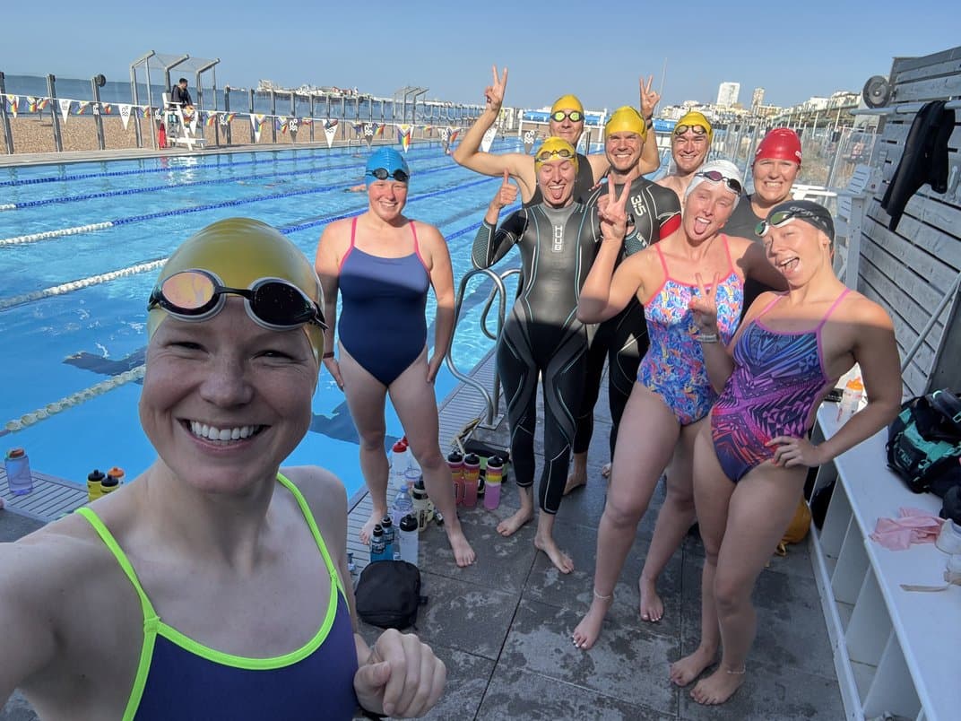 The swimmers on the poolside at Sea Lanes after finishing the 100 x 100