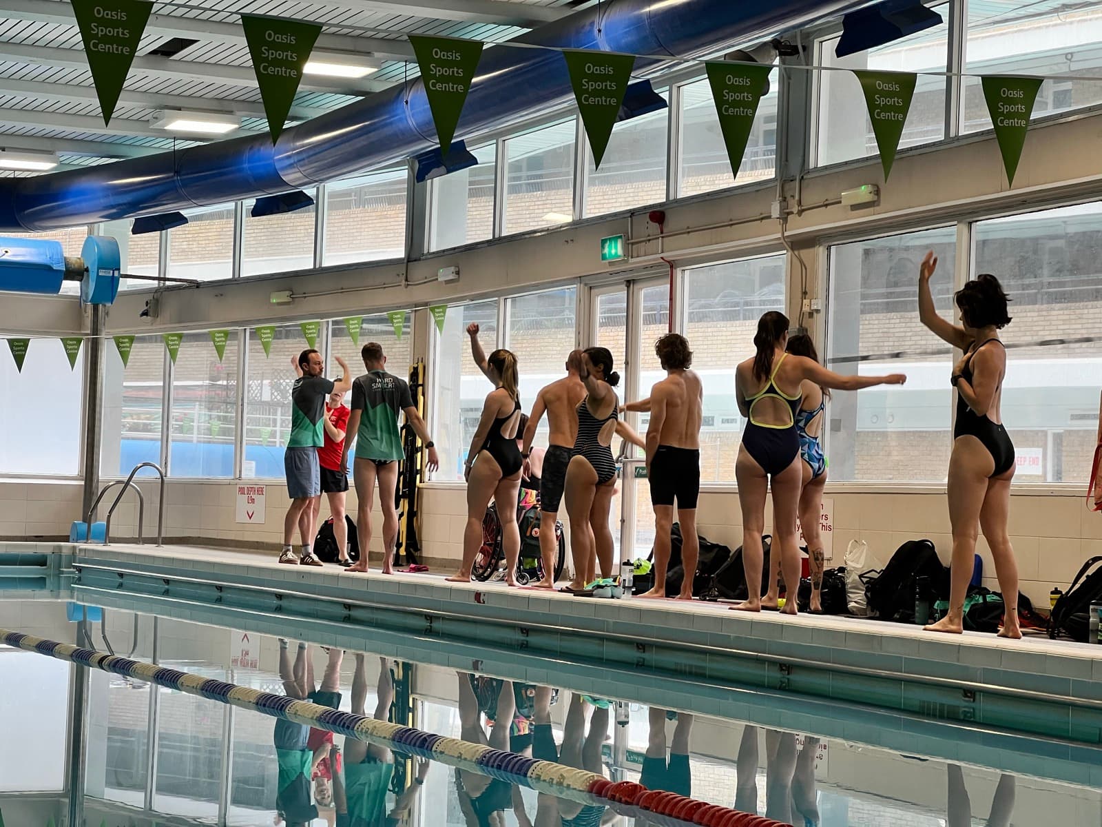 Swimmers lined up on poolside at the Tumbl launch event, Oasis Sports Centre