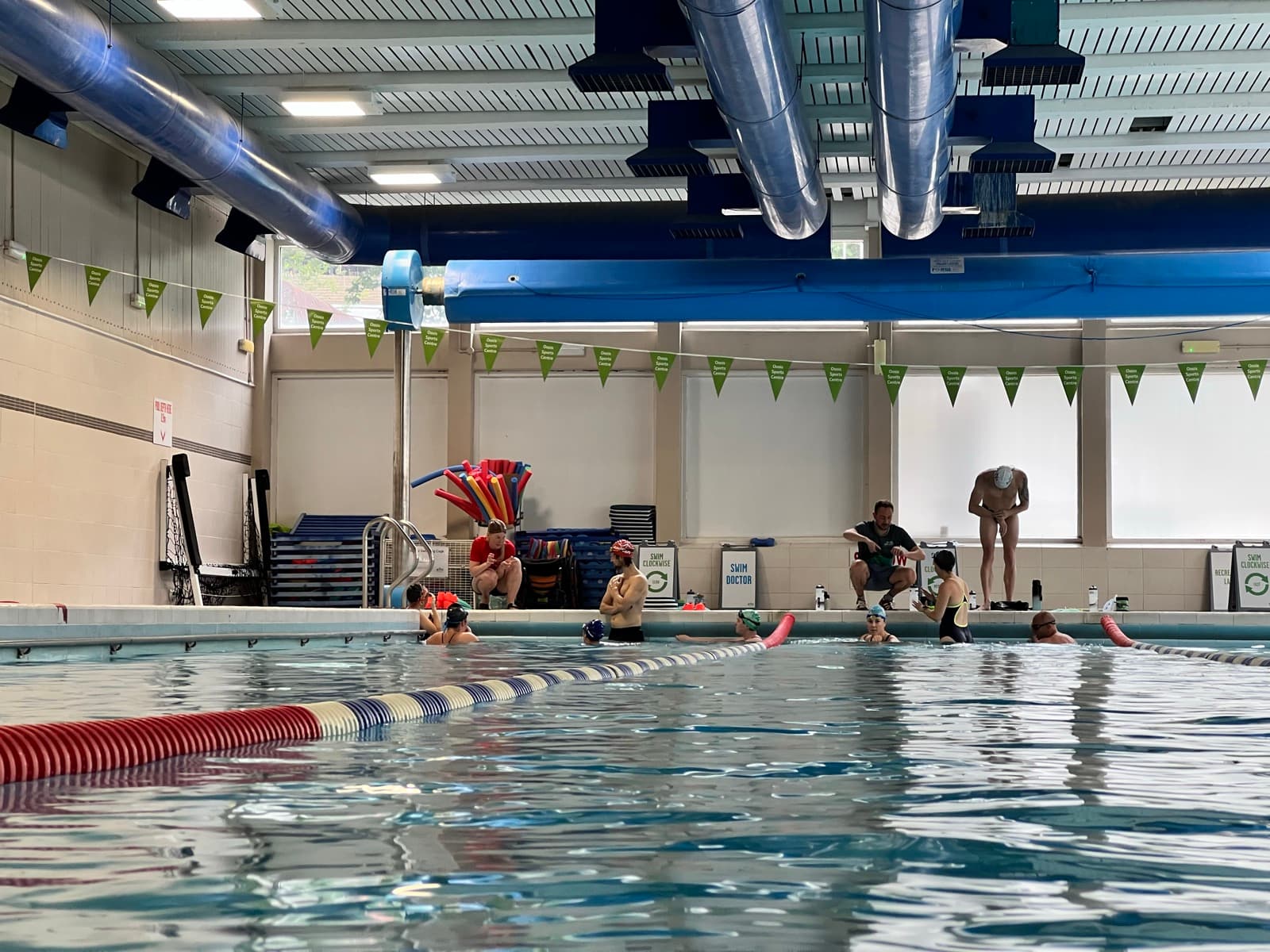 Swimmers in the pool during the coached session